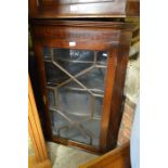 A 19th century mahogany hanging corner cupboard