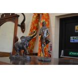 A Franklin Mint bronzed elephant to/w a metal figure of a Masai warrior