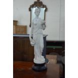 A cast resin figure of a classical female