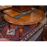 A Victorian mahogany extending wind-out dining table