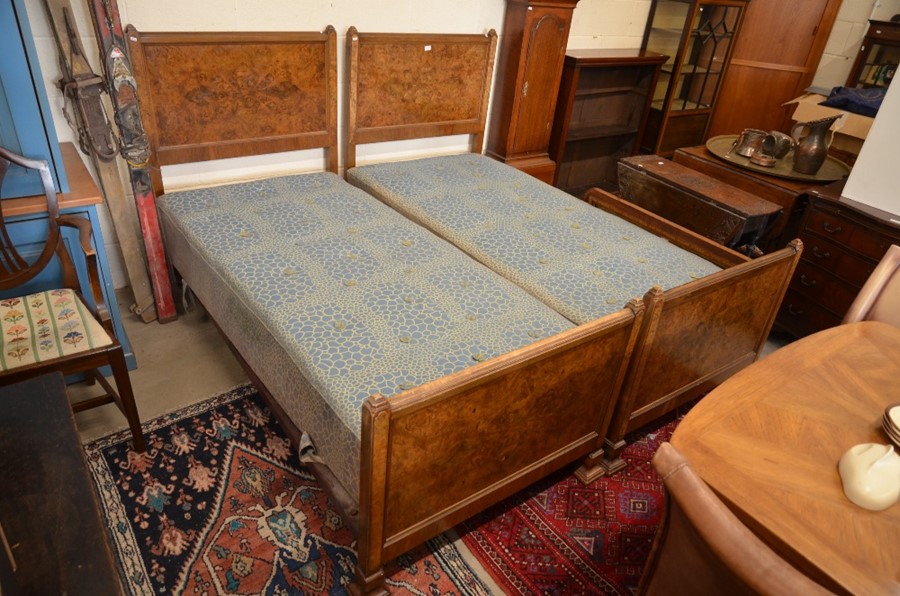 A pair of Edwardian burr walnut single beds