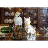 A Chinese famille rose style floral decorated cat, 33 cm high to/w Majolica cockatoo