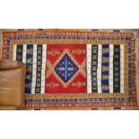 A Turkish geometric rug with kelim panles 255 x 145 cm
