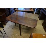 A 19th century mahogany drop leaf dining table