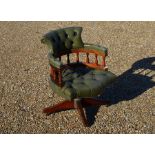 A mahogany framed office swivel chair