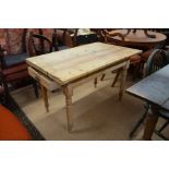 An antique pine kitchen table