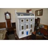 A good quality modern painted dolls house, furniture and fittings