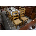 A set of six good quality light oak ladder back dining chairs