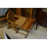 An early 20th century oak metamorphic children's high chair