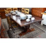 A substantial stained hardwood refectory style dining table