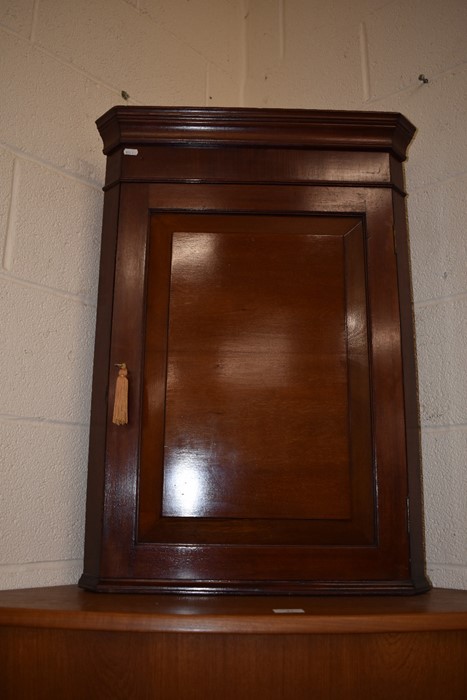 A small Edwardian hanging corner cupboard