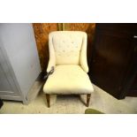 A partially restored linen covered bedroom chair