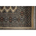 Two Turkoman fawn-ground rugs (2)
