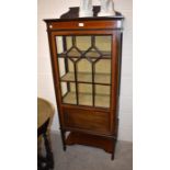 An Edwardian mahogany and satin strung display cabinet