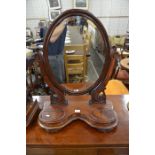A large Victorian mahogany framed oval dressing table mirror