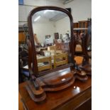 A large Victorian mahogany framed arched dressing table mirror