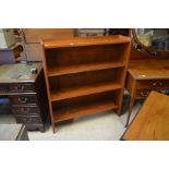 A stained teak open bookcase with three shelves, 101 cm wide