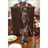 A bronzed spelter figural lamp