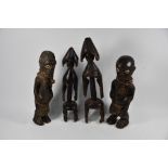 Two pairs of vintage African tribal carved wood male and female figures