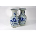 A pair of 19th century Chinese blue and white celadon ground vases, 43 cm high