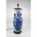 A large Chinese blue and white pale celadon ground baluster vase with stylised chilong handles mount