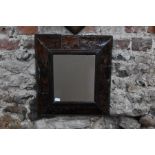 A Queen Anne period tortoise shell framed wall mirror