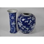 A 19th century Chinese prunus and cracked-ice beaker vase to/w ovoid jar with similar design (2)