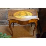 An inlaid satinwood and kingwood serpentine form single drawer side table