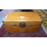 A brass bound camphorwood trunk