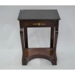 An Empire style gilt mounted mahogany side table