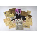 A quantity of cigarette cards in packets, tins and albums