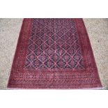 A fine Afghan carpet, 390 cm x 304 cm
