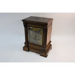 A late 19th century American oak cased mantel clock,