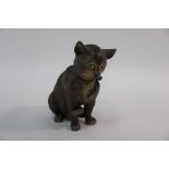 A Continental earthenware seated cat with glass eyes