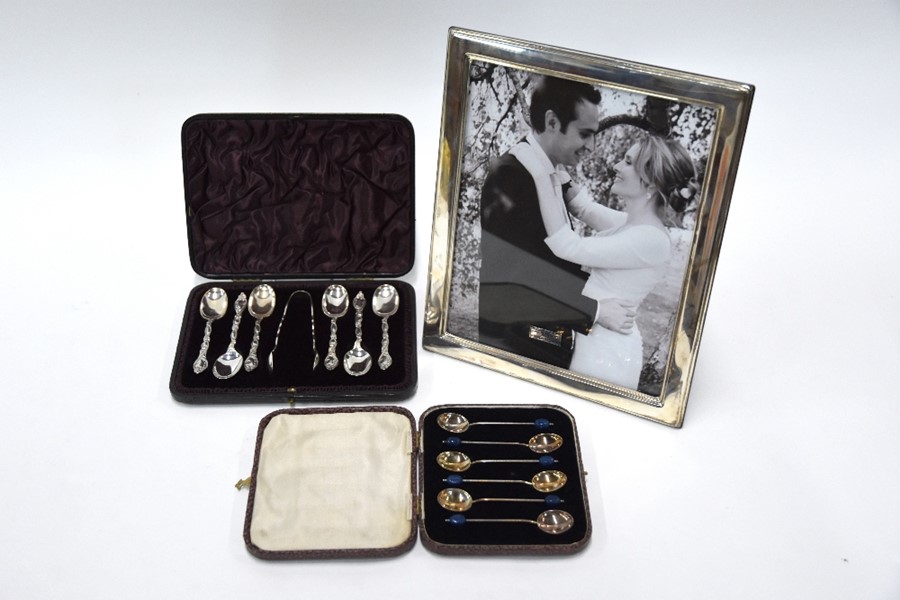 Victorian cased silver teaspoons, gilt coffee spoons and photograph frame