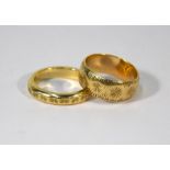 Two 9ct yellow gold wedding bands with incised decoration