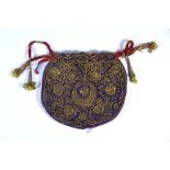 An Indian gold thread embroidered drawstring bag
