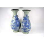A large pair of Chinese blue and white celadon ground vases
