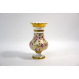 An early 19th century bone china baluster vase