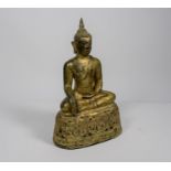 A 19th century Burmese gilt bronze figure of buddha