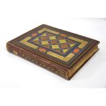 A Victorian album with decorative gilt morocco binding