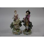 A pair of Georgian Chelsea Derby figures of a lady and gentleman