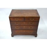 A George III oak caddy top chest ofm two short over three long graduated drawers
