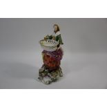 A Chelsea porcelain figure of a seated lady