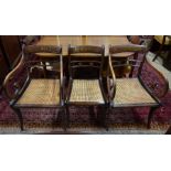 A set of eight Regency brass inlaid rosewood cane seat dining chairs (8)