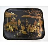A late 19th century papier mache tray decorated in the Japanese style with gilt