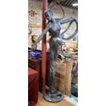A large bronze patinated sculpture of an unclad female figure