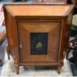 A 19th century satinwood cabinet