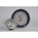A Chinese armorial dish and Yongzheng period famille rose tea bowl (2)