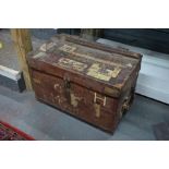 An antique heavy leather trunk and bivouac items